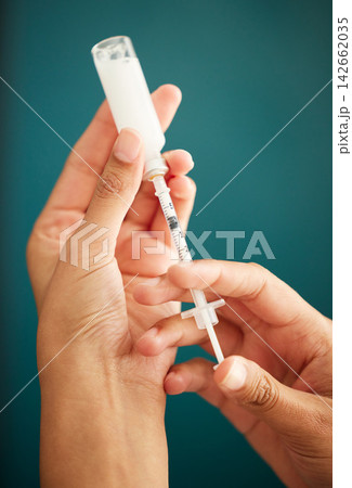 Vaccine, injection and medicine in hands of person with antidote, healthcare and medication. Medical, drugs and syringe closeup with liquid for patient in hospital or clinic with treatment in bottle 142662035