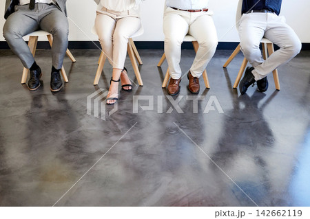 Interview, legs and row of people in waiting room with mock up space on floor at recruitment agency. Men, women and shoes in lobby for onboarding, human resources or opportunity for hiring at new job 142662119