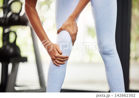 Person, pain and leg for gym fitness, exercise or injury for cardio training in outdoor activity. Female lady and active indoor for wellness, physical sport or workout for health recreation or strain 142662302