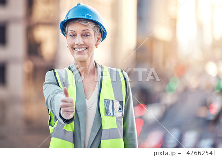 Construction worker, woman and thumbs up for portrait in city for vote, choice or good service. Mature architect, metro building and like sign for urban expansion, property or real estate development Construction worker, woman and thumbs up for portrait in city for vote, choice or good service. Mature architect, metro building and like sign for urban expansion, property or real estate development 142662541