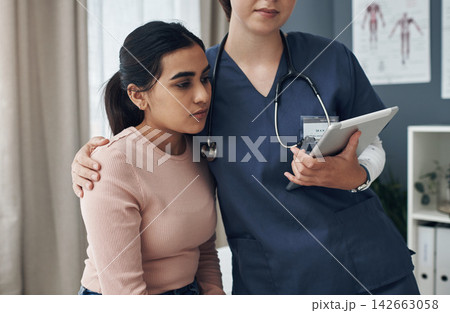 Nurse, hugging and woman in hospital for care, comfort and empathy for medical wellness appointment in clinic for health. Tablet, bad news and result with professional, diagnosis and compassion 142663058
