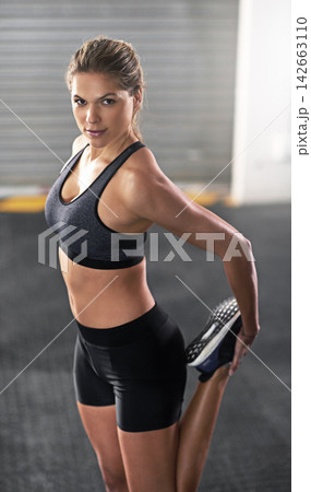 Portrait, exercise and woman stretching legs in gym for fitness, training and workout practice for healthy body wellness. Muscle, athlete and warm up for energy, sports and flexibility in Germany Portrait, exercise and woman stretching legs in gym for fitness, training and workout practice for healthy body wellness. Muscle, athlete and warm up for energy, sports and flexibility in Germany 142663110