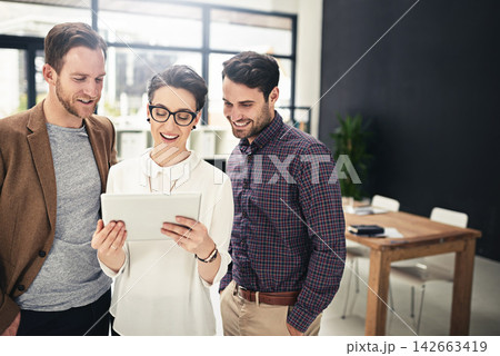 Tablet, research or creative people in startup meeting for solution, teamwork or group discussion in office. Social media manager, talk or happy designers speaking of planning, ideas or online blog 142663419