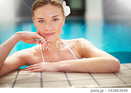 Portrait, woman in swimming pool and relax for vacation, holiday or wellness and rest. Female person, calm and fresh at resort with water for summer getaway, weekend break or healthy self care Portrait, woman in swimming pool and relax for vacation, holiday or wellness and rest. Female person, calm and fresh at resort with water for summer getaway, weekend break or healthy self care 142663640