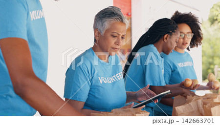 People, volunteering and tablet for food, charity and non profit donation with group, teamwork and management. Woman or senior manager with packaging groceries and digital technology for distribution People, volunteering and tablet for food, charity and non profit donation with group, teamwork and management. Woman or senior manager with packaging groceries and digital technology for distribution 142663701