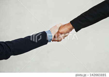 Studio, handshake and business people with agreement for teamwork, partnership and networking. B2b, deal and professional workers with thank you, welcome or support in cooperation by white background Studio, handshake and business people with agreement for teamwork, partnership and networking. B2b, deal and professional workers with thank you, welcome or support in cooperation by white background 142663891
