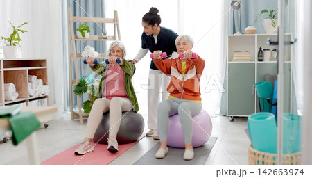 Senior people, fitness class and coach with tablet, ball and dumbbell for muscle health support or balance. Exercise, training and workout woman and personal trainer in pilates class helping clients Senior people, fitness class and coach with tablet, ball and dumbbell for muscle health support or balance. Exercise, training and workout woman and personal trainer in pilates class helping clients 142663974