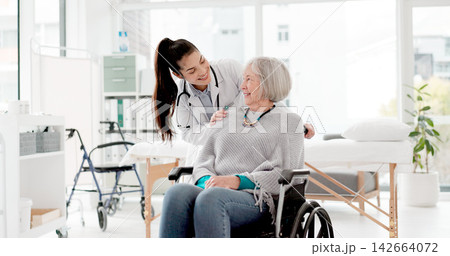 Happy, senior care and woman with a disability and doctor for healthcare, support and consulting. Smile, love and face portrait of a medical employee and elderly patient in a wheelchair at a clinic 142664072