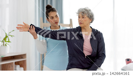 Physiotherapy, arm and senior woman consulting physiotherapist for injury, healthcare and osteoporosis. Chiropractor, stretch or old person with pain, shoulder and rehabilitation with medical problem Physiotherapy, arm and senior woman consulting physiotherapist for injury, healthcare and osteoporosis. Chiropractor, stretch or old person with pain, shoulder and rehabilitation with medical problem 142664161