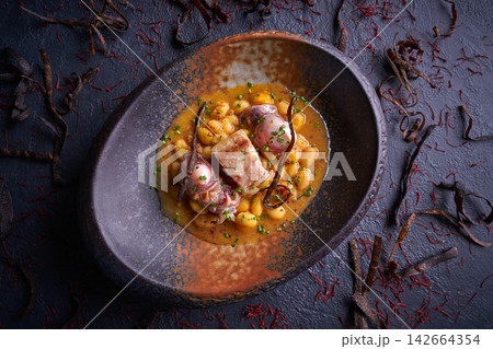 Judias pochas beans with calamari 142664354