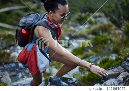 Adventure, exercise and hiking with woman in mountains for active hobby, health or morning recreation. Fitness, glasses and mountain climbing with person outdoor in nature for challenge or training 142665073