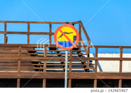 No Diving sign near the wooden pier No Diving sign near the wooden pier 142665967