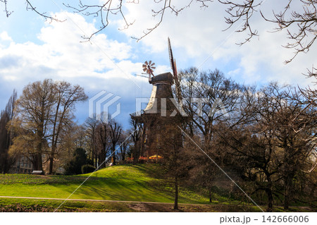 Old wooden windmill in park in Bremen, Germany Old wooden windmill in park in Bremen, Germany 142666006