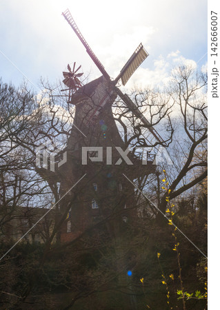 Old wooden windmill in park in Bremen, Germany Old wooden windmill in park in Bremen, Germany 142666007