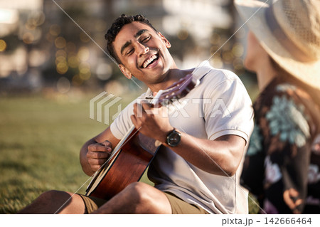 Picnic, date and man with guitar for happiness, love and anniversary in Puerto Rico. Couple, happy and music in outing on grass for summer, relax or romance together at sunset with instrument in park Picnic, date and man with guitar for happiness, love and anniversary in Puerto Rico. Couple, happy and music in outing on grass for summer, relax or romance together at sunset with instrument in park 142666464