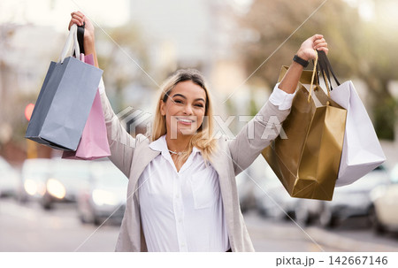 Portrait, woman and celebrate in city for shopping on luxury vacation or trip in San Francisco, bags and happy for retail sale. Girl, outdoor and summer holiday in street for fashion discount or tour Portrait, woman and celebrate in city for shopping on luxury vacation or trip in San Francisco, bags and happy for retail sale. Girl, outdoor and summer holiday in street for fashion discount or tour 142667146