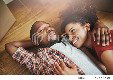 Sleep, relax and black couple on floor in new home with boxes, tired hug and mortgage with smile. Dream, man and happy woman in house with romantic embrace, love and property investment with fatigue. Sleep, relax and black couple on floor in new home with boxes, tired hug and mortgage with smile. Dream, man and happy woman in house with romantic embrace, love and property investment with fatigue. 142667656