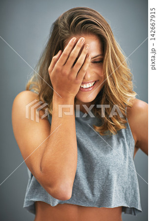 Fashion, youth and woman in studio laughing with positive attitude, wellness and fun clothes in USA. Smile, relax and happy gen z girl in cool, trendy and casual style and isolated on grey background Fashion, youth and woman in studio laughing with positive attitude, wellness and fun clothes in USA. Smile, relax and happy gen z girl in cool, trendy and casual style and isolated on grey background 142667915