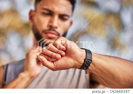 Hand, pulse and man with smart watch outdoor to track heart rate for cardio, exercise and training for race. Male athlete, wristwatch or stopwatch to monitor performance or endurance and wellness. Hand, pulse and man with smart watch outdoor to track heart rate for cardio, exercise and training for race. Male athlete, wristwatch or stopwatch to monitor performance or endurance and wellness. 142668397