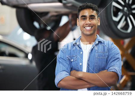 Portrait, man and smile as mechanic in automobile, workshop and repairs with confident or pride as engineer. Male person, worker and automotive in industry as maintenance, service and expert for cars Portrait, man and smile as mechanic in automobile, workshop and repairs with confident or pride as engineer. Male person, worker and automotive in industry as maintenance, service and expert for cars 142668759