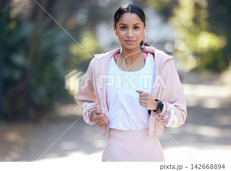 Portrait, woman and running outdoor for fitness, workout and exercise with smile as routine. Runner, female person and training for physical strength, wellness and mental health with sports in nature Portrait, woman and running outdoor for fitness, workout and exercise with smile as routine. Runner, female person and training for physical strength, wellness and mental health with sports in nature 142668894