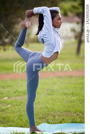 Yoga, balance and woman stretching in park for wellness, healthy body and warm up in nature. Pilates, fitness and person on sports mat, grass and lawn for exercise, training and workout outdoors Yoga, balance and woman stretching in park for wellness, healthy body and warm up in nature. Pilates, fitness and person on sports mat, grass and lawn for exercise, training and workout outdoors 142669209