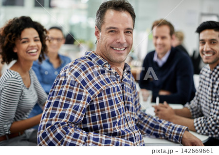 Coworking, meeting and portrait of creative businessman with team in cooperation on project. Confident, manager and mature leader of collaboration in editing, article or planning news magazine 142669661