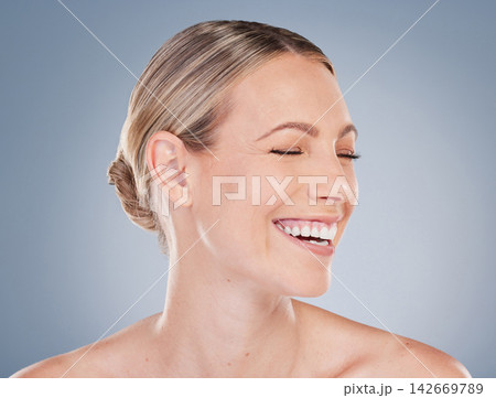 Happy, woman and skincare for antiaging with beauty or dermatology on studio background. Natural, makeup and model with smile for cosmetics, treatment or clean facial for wellness and aesthetic 142669789