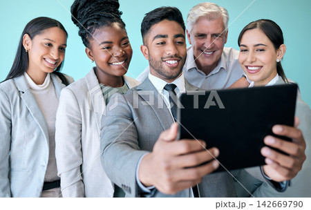 Business, people and tablet for selfie in studio, professional coworkers and profile picture for teamwork together for blog. Blue background, collaboration and employees, social media and support Business, people and tablet for selfie in studio, professional coworkers and profile picture for teamwork together for blog. Blue background, collaboration and employees, social media and support 142669790