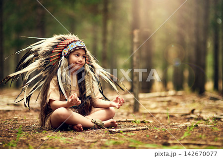 Native American chief, forest and nature for meditation in childhood for connection with war bonnet in woods. Faith, girl and relax with mindfulness, peace and insight with reflection in California 142670077