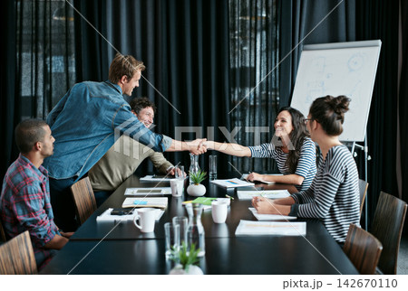 People, deal and handshake in office meeting with partnership for contract or business success. Shaking hands, trust and consultant for onboarding in workplace boardroom by collaboration or diversity 142670110