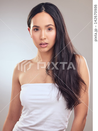 Beauty, cosmetics and hair with portrait of woman in studio on gray background for natural wellness. Aesthetic, dermatology and skincare with model at spa for change, makeup or transformation 142670986