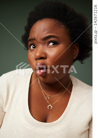 Black woman, fish lips and funny face for comedy, playful and goofy isolated in studio background. Female person, casual and kiss mouth joke with comic eyes for crazy, confident and silly humor Black woman, fish lips and funny face for comedy, playful and goofy isolated in studio background. Female person, casual and kiss mouth joke with comic eyes for crazy, confident and silly humor 142671216