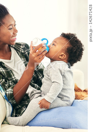 Mother, feeding and baby drink bottle for nutrition or nourishment, weight gain and healthcare for growth or development. Parent, boy toddler and nursing with rooibos tea for hydration and colic gas Mother, feeding and baby drink bottle for nutrition or nourishment, weight gain and healthcare for growth or development. Parent, boy toddler and nursing with rooibos tea for hydration and colic gas 142671428