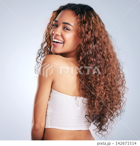 Woman, smile and healthy haircare in studio, portrait and natural curls, texture and growth with treatment for beauty. Happy, female person and cosmetics, shine or results on white background Woman, smile and healthy haircare in studio, portrait and natural curls, texture and growth with treatment for beauty. Happy, female person and cosmetics, shine or results on white background 142671514