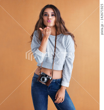Happy, woman and camera with air kiss, portrait and photography in studio with love gesture. Gen z, vintage and hand sign with photo and creative college student with photographer with emoji Happy, woman and camera with air kiss, portrait and photography in studio with love gesture. Gen z, vintage and hand sign with photo and creative college student with photographer with emoji 142671925