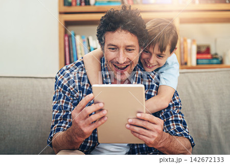 Home, tablet and father with child on sofa for watching movies, cartoons and online entertainment. Family, love and happy dad with son on digital tech for internet, video call and relax on weekend Home, tablet and father with child on sofa for watching movies, cartoons and online entertainment. Family, love and happy dad with son on digital tech for internet, video call and relax on weekend 142672133