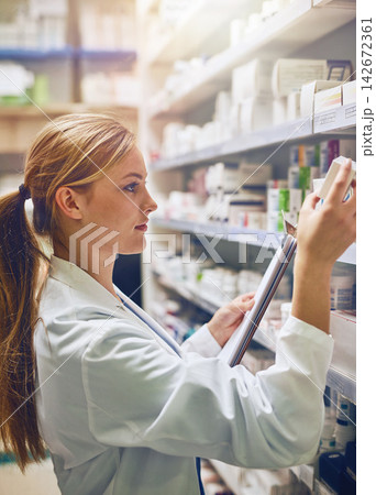 Woman, pharmacist or reading boxes for inventory or stock check at pharmacy for pills information. Clipboard, medical internship or girl by shelf for pharmaceutical drugs for medicine and product Woman, pharmacist or reading boxes for inventory or stock check at pharmacy for pills information. Clipboard, medical internship or girl by shelf for pharmaceutical drugs for medicine and product 142672361