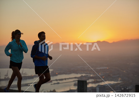 Sunrise, couple and silhouette with mountain running for training, exercise and fitness with cardio. Wellness, sport and athlete with runner partner in nature together at morning with mockup space 142672915