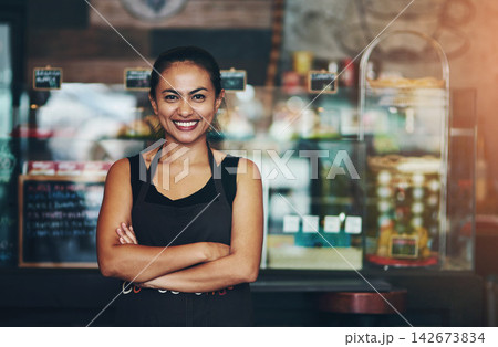 Coffee shop, business owner or portrait of happy woman with arms crossed in startup or restaurant with smile. About us, entrepreneur or proud waitress ready for service, sale or excellence in cafe Coffee shop, business owner or portrait of happy woman with arms crossed in startup or restaurant with smile. About us, entrepreneur or proud waitress ready for service, sale or excellence in cafe 142673834