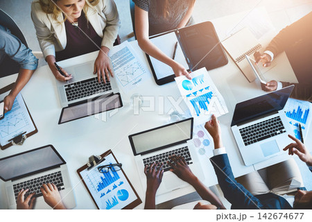 Laptop, paperwork and business people in teamwork with charts, graphs or statistics for productivity growth. Data analysis, men and women with tech for performance, development or coworking in office 142674677