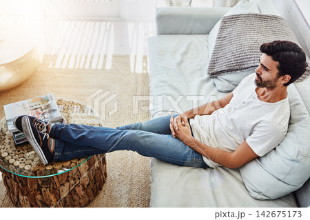 Man, relax and thinking in home with top view, comfortable, daydreaming or weekend break on sofa. Person, above and thoughtful on couch in lounge for me time or peaceful leisure in apartment or house Man, relax and thinking in home with top view, comfortable, daydreaming or weekend break on sofa. Person, above and thoughtful on couch in lounge for me time or peaceful leisure in apartment or house 142675173