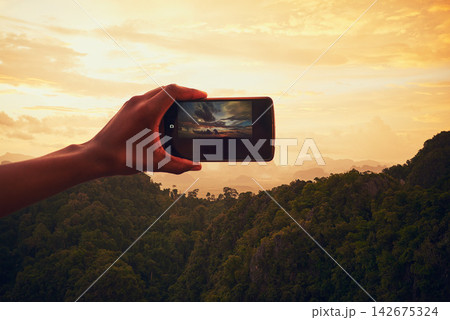 Sunset, nature and hand with cellphone for picture on vacation, adventure or weekend trip in Brazil. Evening, mobile and person with phone for photography of outdoor dawn sky on holiday for travel. 142675324