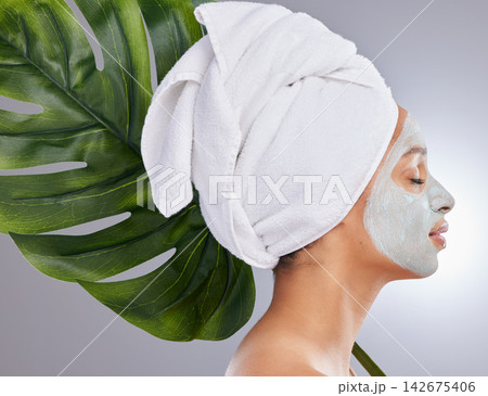 Leaf, woman and face mask for skincare, profile and facial treatment on white background. Beauty, natural or organic for female person, smile and cosmetic for dermatology detox and exfoliate product Leaf, woman and face mask for skincare, profile and facial treatment on white background. Beauty, natural or organic for female person, smile and cosmetic for dermatology detox and exfoliate product 142675406