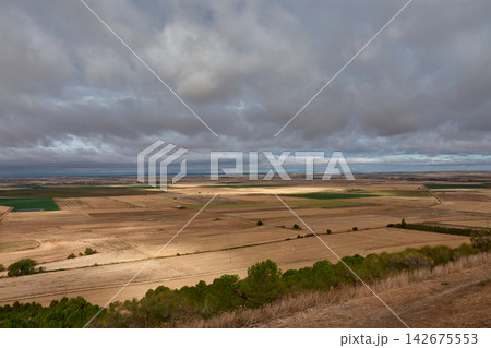 Rural landscape of Uruena, Valladolid, Spain, with farmland seen from the castle wall on a cloudy day 142675553