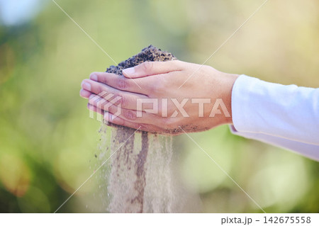 Soil, hands and gardener in outdoor garden for agriculture, sustainability or drought with bokeh. Closeup, nature and person with sand for climate change, inspection and compost on earth day Soil, hands and gardener in outdoor garden for agriculture, sustainability or drought with bokeh. Closeup, nature and person with sand for climate change, inspection and compost on earth day 142675558