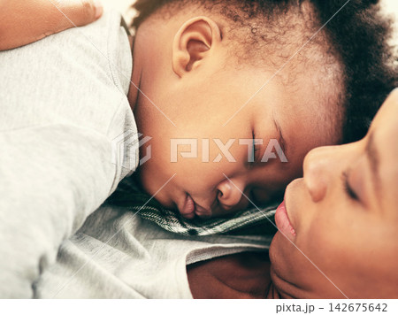 Sleeping, home and black mother with baby, rest and break with comfort, bonding together and calm. Apartment, family and single parent with mama, infant and tired with fatigue, exhausted and relaxing Sleeping, home and black mother with baby, rest and break with comfort, bonding together and calm. Apartment, family and single parent with mama, infant and tired with fatigue, exhausted and relaxing 142675642