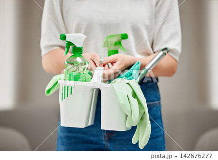 Hotel, cleaning service and hand of person with product for hospitality, maintenance and housekeeping. Living room, apartment and cleaner with equipment for bacteria removal, safety and hygiene 142676277