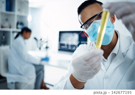 Scientist, experiment and test tube in lab for research, clinical trial and biotechnology or chemistry. Chemist, pharmacist and breakthrough for problem solving, medical and science for healthcare 142677193