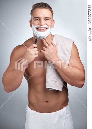 Portrait, happy man and shaving in studio for grooming, maintenance and beard cream by backdrop. Male person, body and pride with foam for skincare, hair removal and facial product by grey background Portrait, happy man and shaving in studio for grooming, maintenance and beard cream by backdrop. Male person, body and pride with foam for skincare, hair removal and facial product by grey background 142677233